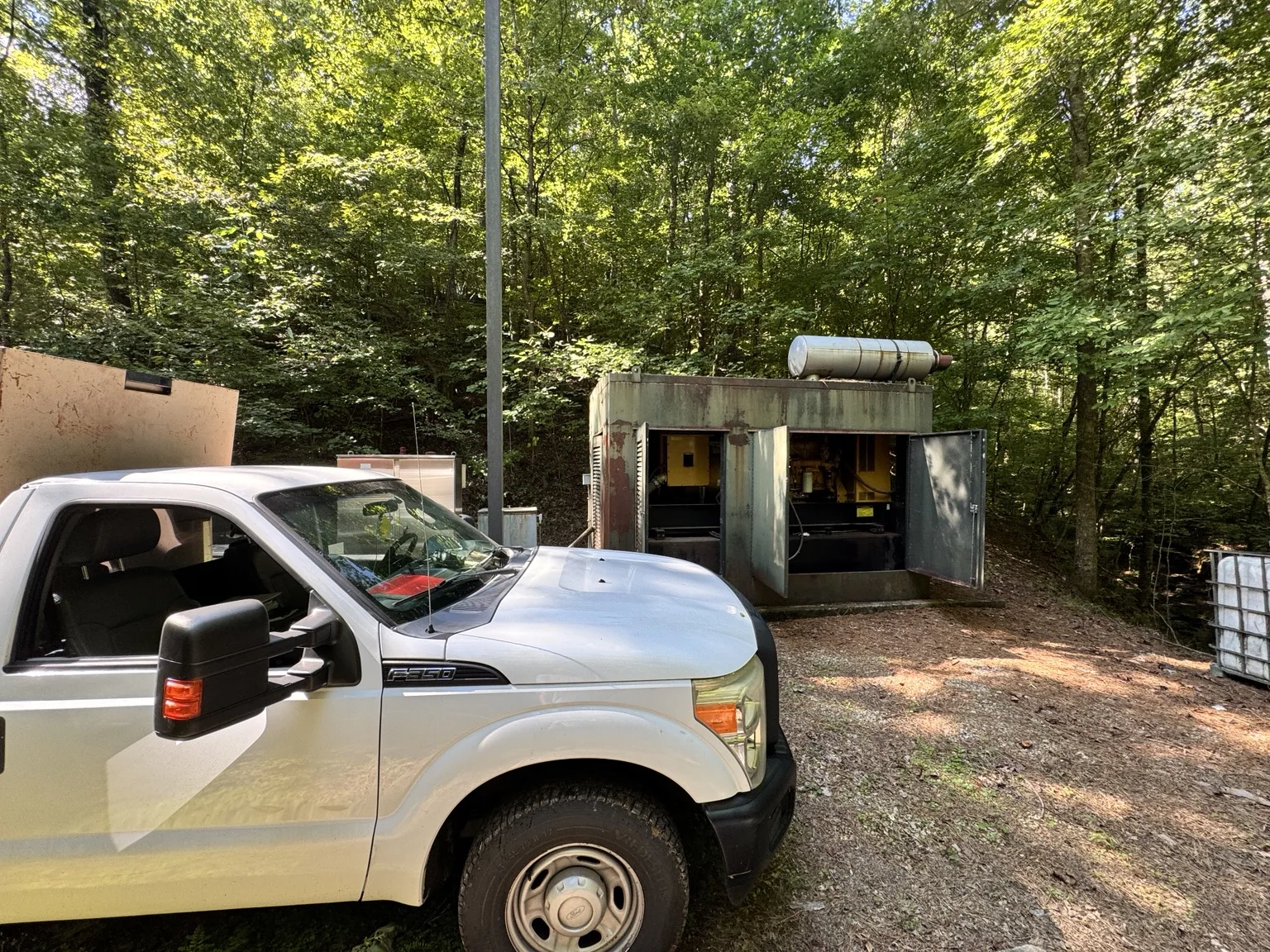 On-site troubleshooting and service of a 300 kW Caterpillar generator at a remote utility facility.